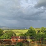 Tuscany outdoor scene of green hills and darkening skies